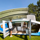 The electric campervan parked up with its roof popped open